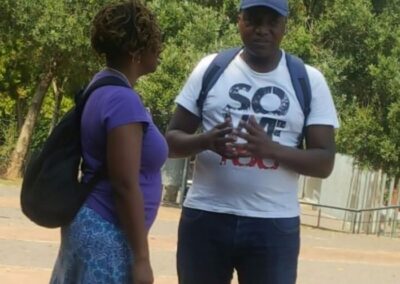 A guest learning about the history of Soweto from Tourist Guide Sibusiso Mhlanga